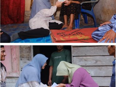 Bupati Siak Dr. Afni Zulkifli saat memberi bantuan. (Foto: ist)