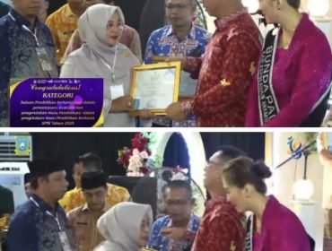 Bupati Anambas, Aneng menyerahkan sertifikat penghargaan kepada  Camat Jemaja Timur, Tetti Amalia, S.E. (Foto: ist)