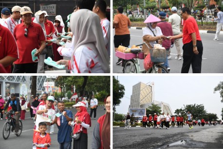 Jalan santai dan pembagian masker kepada masyarakat di Car Free Day (CFD) di Jalan Jenderal Sudirman, Pekanbaru. (Foto: ist)